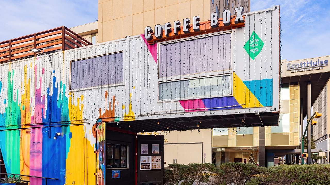 Container boxes with art and a "Coffee Box" sign on them