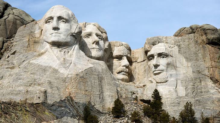 The Mount Rushmore monument with the heads of four presidents carved on a mountain
