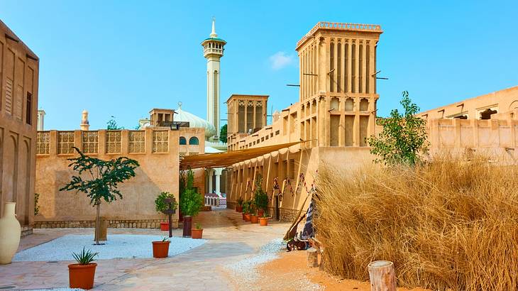 Traditional Arabian architecture with wind towers and a courtyard