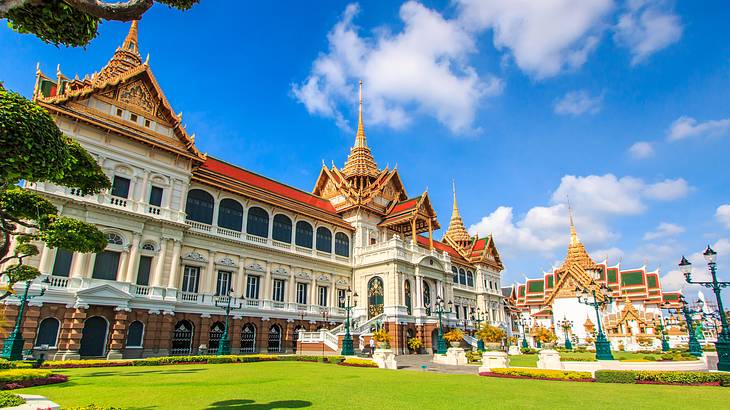 The gold and white Grand Palace is a famous landmark in Thailand