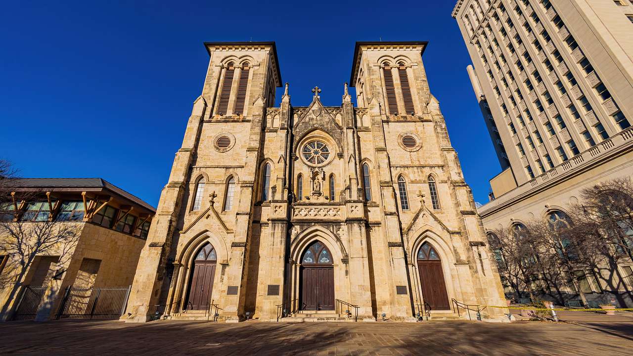 A Gothic-style church with two towers on a sunny day