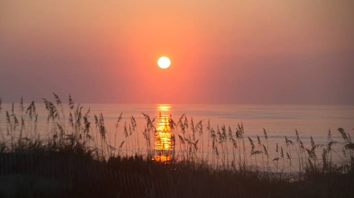 See the sunrise and visit many breweries in the Outer Banks