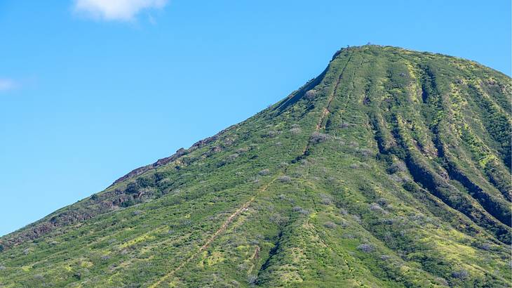 Close up shot of a volcano top against a clear blue sky