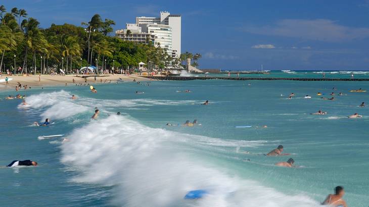 The wavy Waikiki Beach is one of the famous landmarks in Waikiki, Hawaii