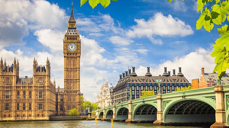 Starting from the left, Palace of Westminster, Big Ben and a bridge over water Starting from the left, Palace of Westminster, Big Ben and a bridge over water