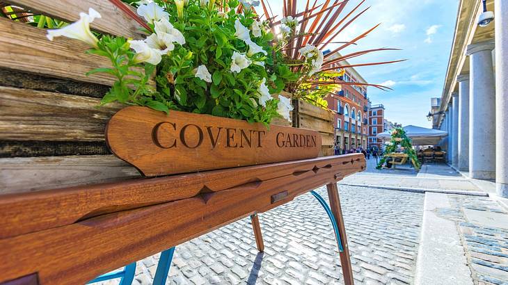 Convent Garden sign on a flower stall in the middle of a plaza