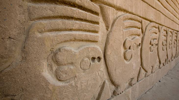 A close up of carvings in a stone wall A close up of carvings in a stone wall