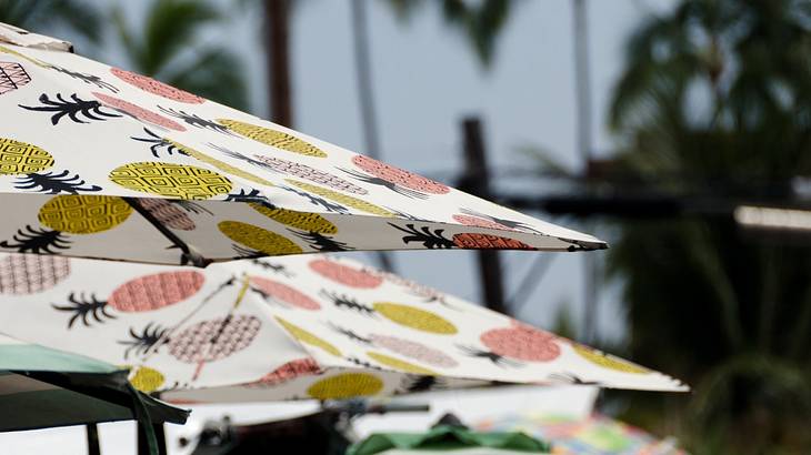 Up close image of umbrellas with pineapple prints on them