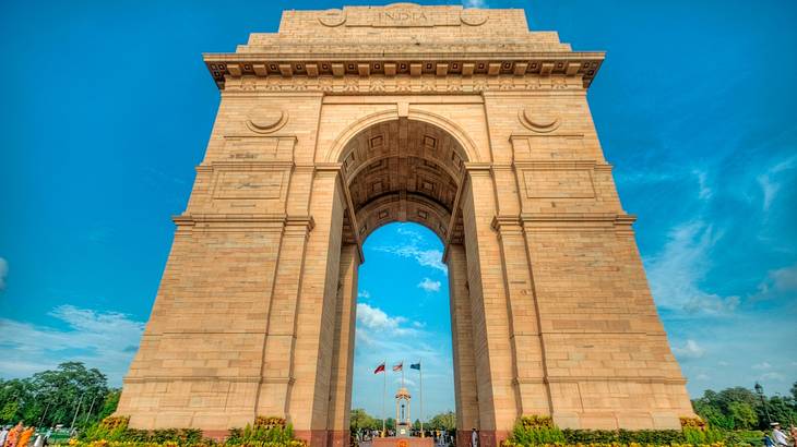 A huge monumental gate standing tall against blue sky