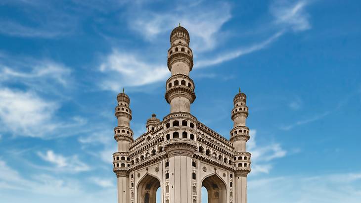 An ancient monument with four towers against the blue sky An ancient monument with four towers against the blue sky