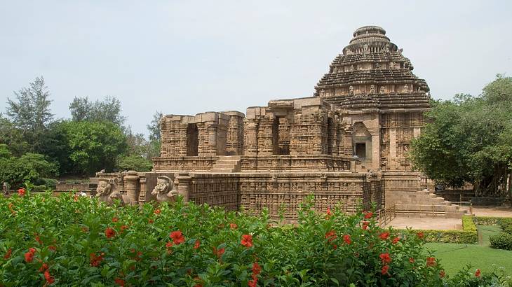 The exterior of a chariot-like temple surrounded by nature The exterior of a chariot-like temple surrounded by nature