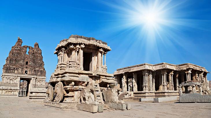 Ancient ruins and temples on bare ground with the sun blaring above Ancient ruins and temples on bare ground with the sun blaring above
