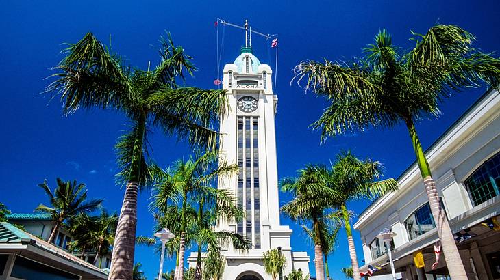 The tall white Aloha Tower is one of the famous landmarks in Oahu, Hawaii The tall white Aloha Tower is one of the famous landmarks in Oahu, Hawaii