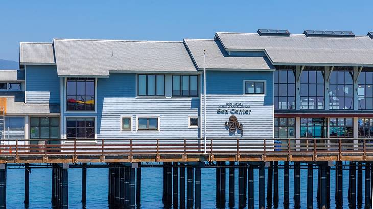 Light blue wharf cottage with windows overlooking the sea Light blue wharf cottage with windows overlooking the sea