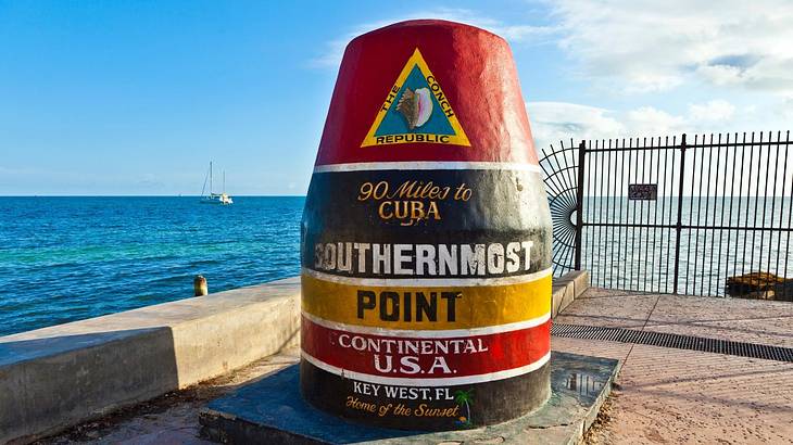 A marker for the southernmost point of the US by the ocean