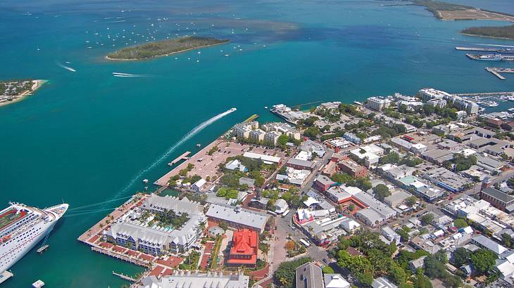 An aerial view of Key West with buildings and ocean surrounding