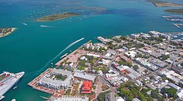 An aerial view of Key West with buildings and ocean surrounding