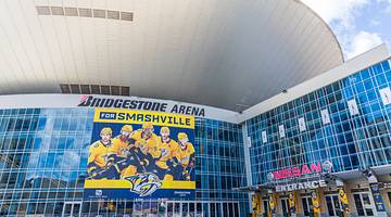 A sports arena with hockey banner that says Smashville below a Bridgestone Area sign