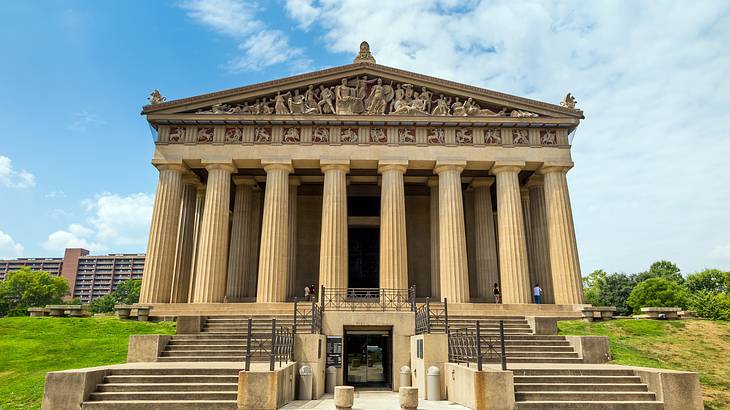 A Greek-style Parthenon with columns and steps in front of it