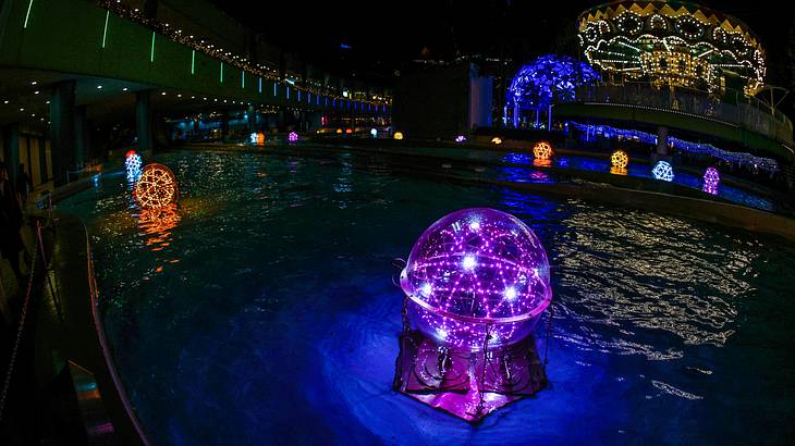 Night shot of bright and colorful led illuminations on water