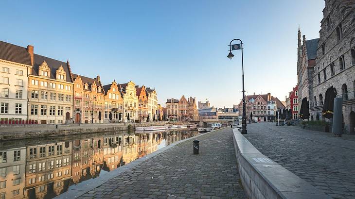 A river between parallel streets lined with medieval buildings