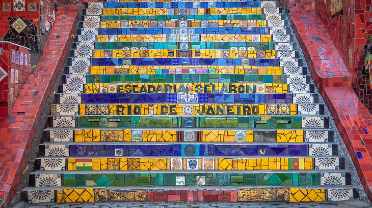 Steps of a staircase decorated with a mosaic of colourful tiles
