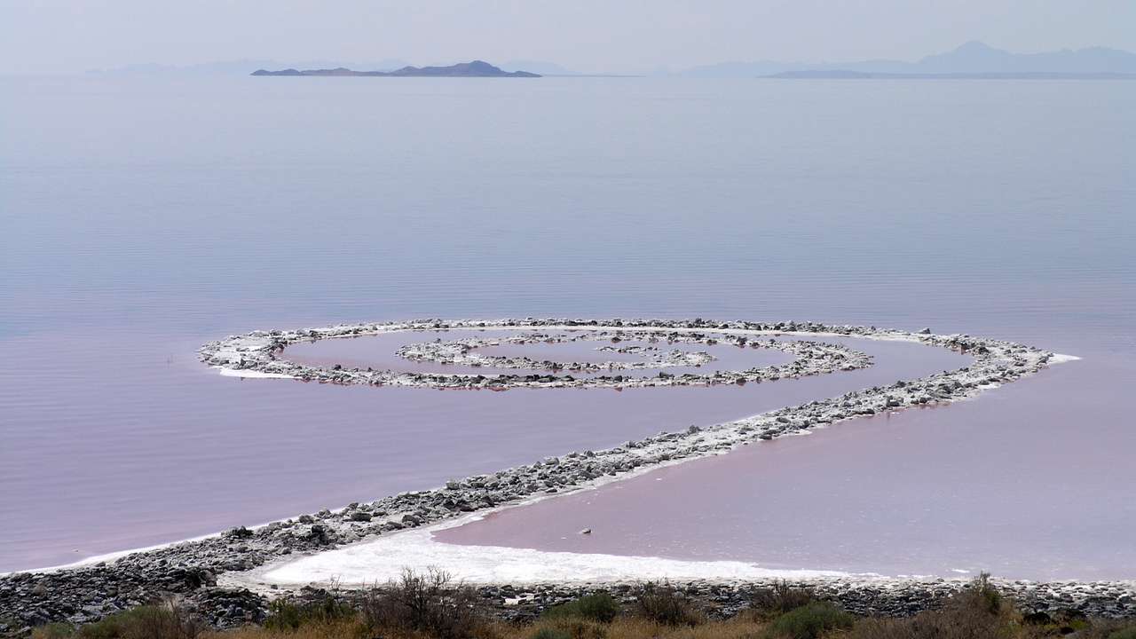 A spiral earthwork in a lake with mysterious pink water