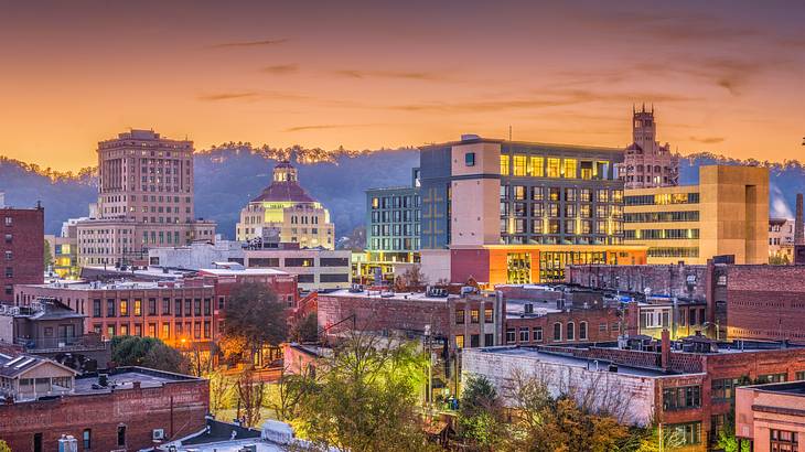 A city skyline at sunset with an orange sky A city skyline at sunset with an orange sky