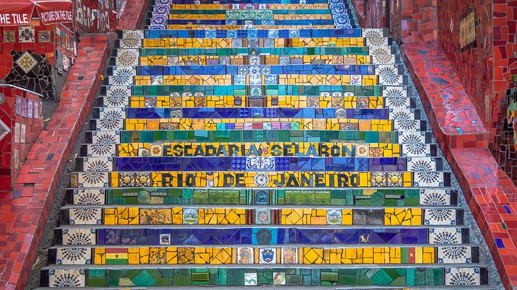 Steps of a staircase decorated with a mosaic of colourful tiles