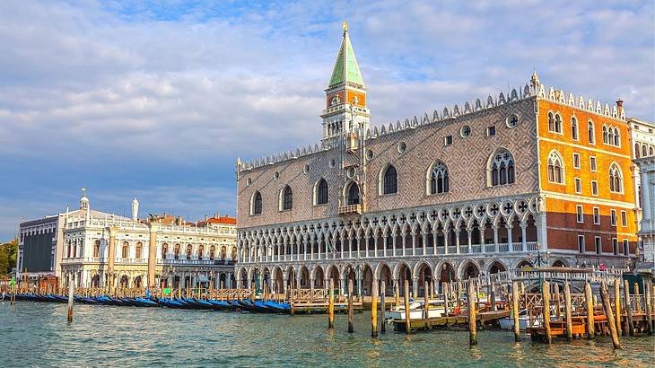 Stunning gothic building facade along the water on a late afternoon