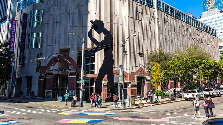 A art museum was a statue out the front on a street A art museum was a statue out the front on a street