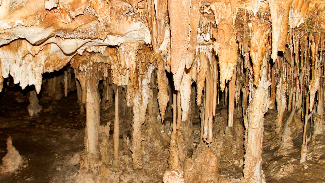 Up-close shot of natural stalactites and stalagmites in a cave