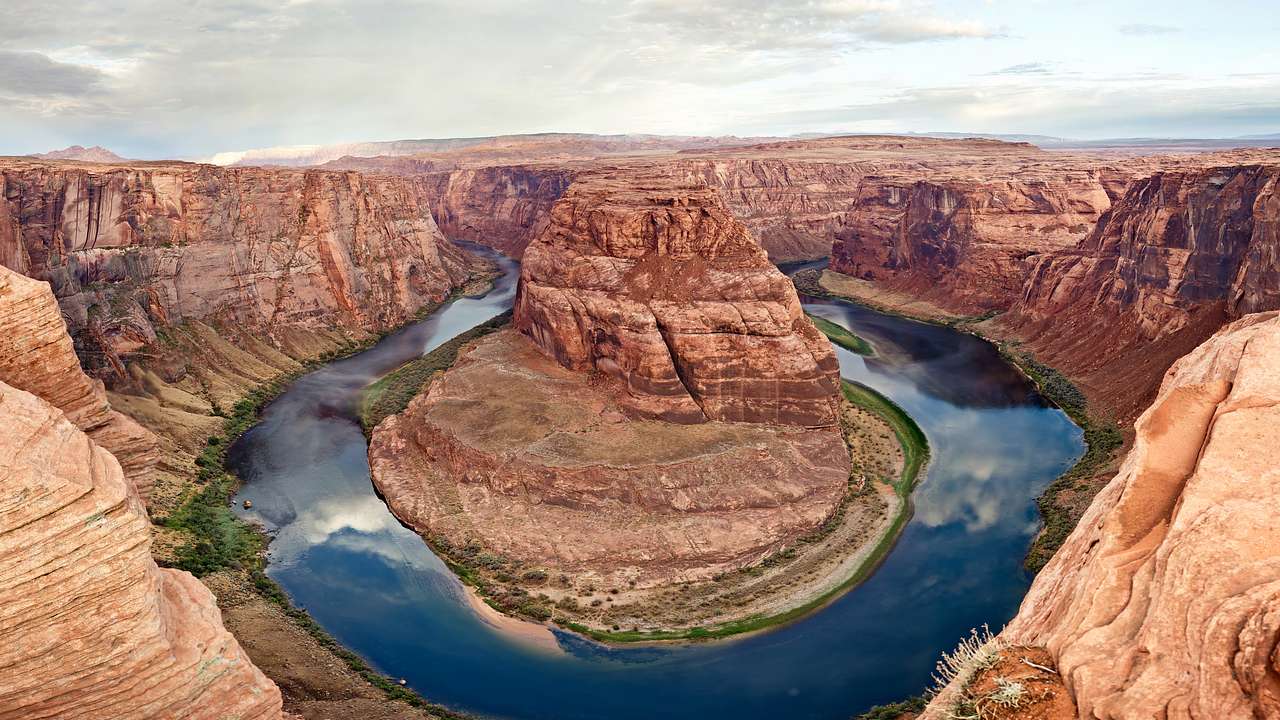 Looking down onto bold canyons with a horseshoe-shaped river in the middle