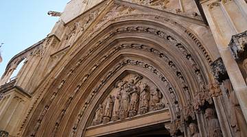 Stone carving of apostles on an archway entrance to a church